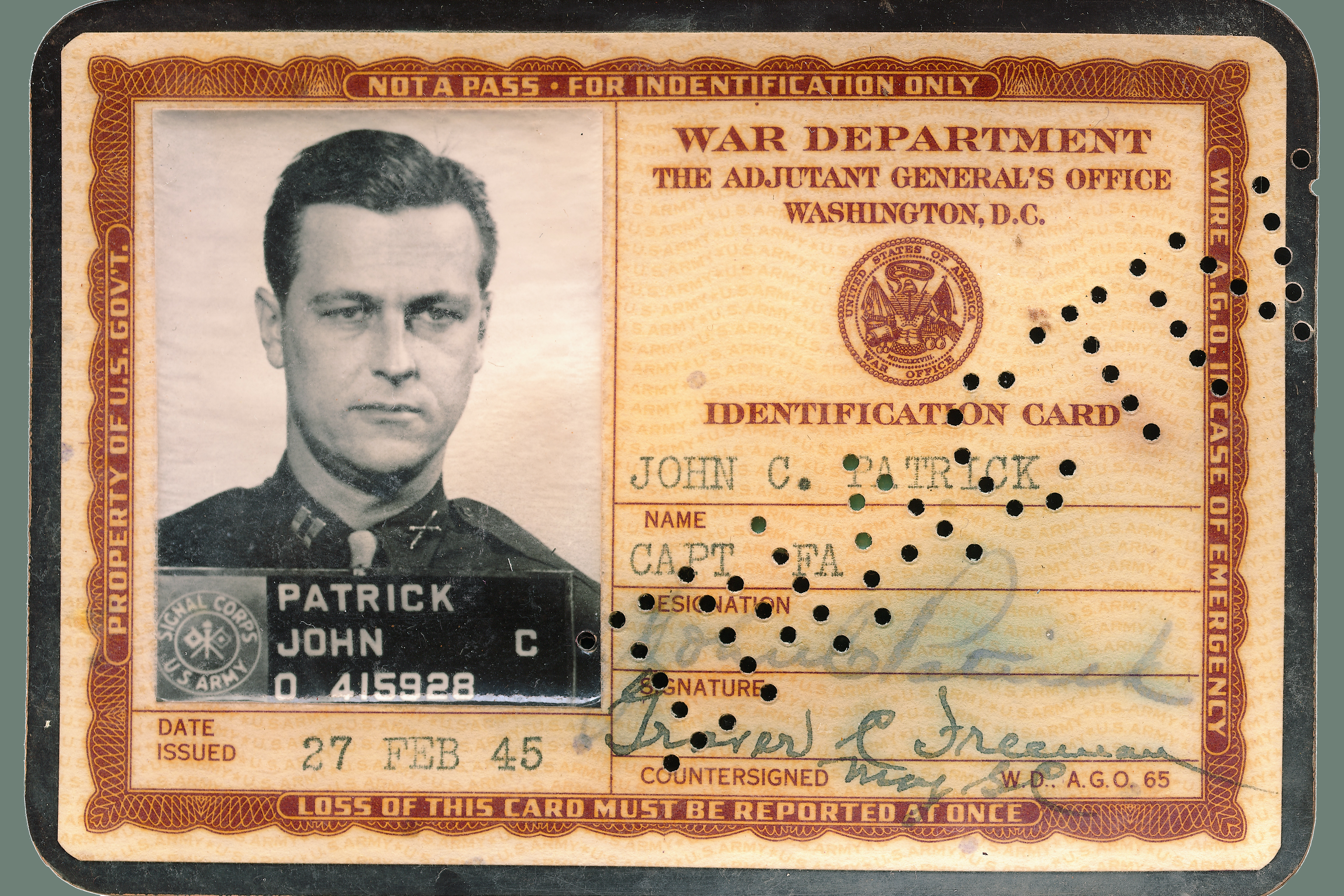 A war department identification card document for John C Patrick issued on February 27th 1945 Signal corps of the US Army